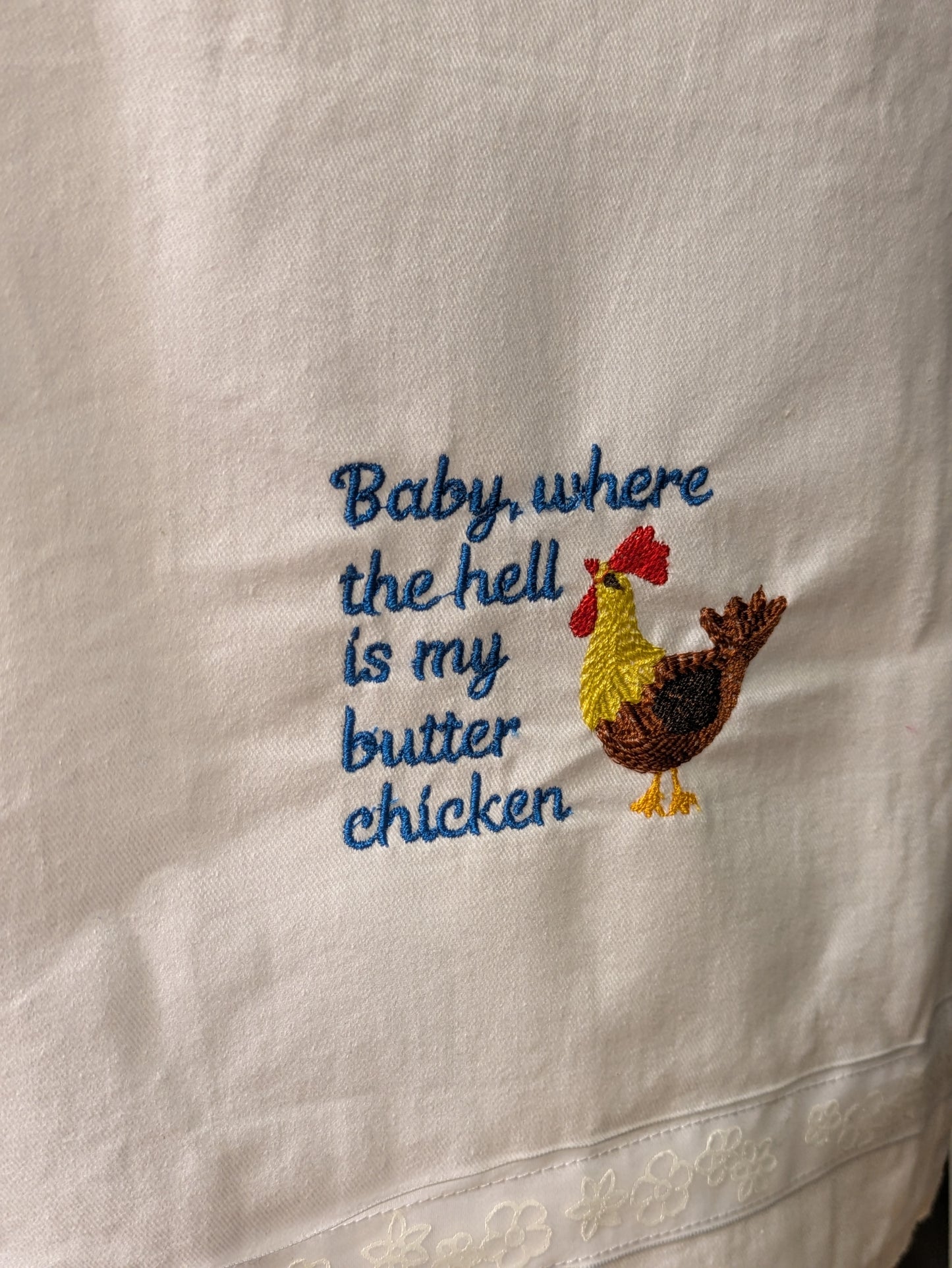 Baby butter chicken tea towel by Bobbin Heads featuring a humorous design with vibrant colors and a playful theme.