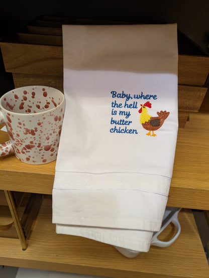 Baby tea towel featuring humorous "Where The Hell Is My Butter Chicken" design by Bobbin Heads, made of soft absorbent fabric.